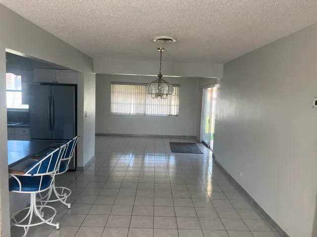 a view of entryway and hall with a bath tub