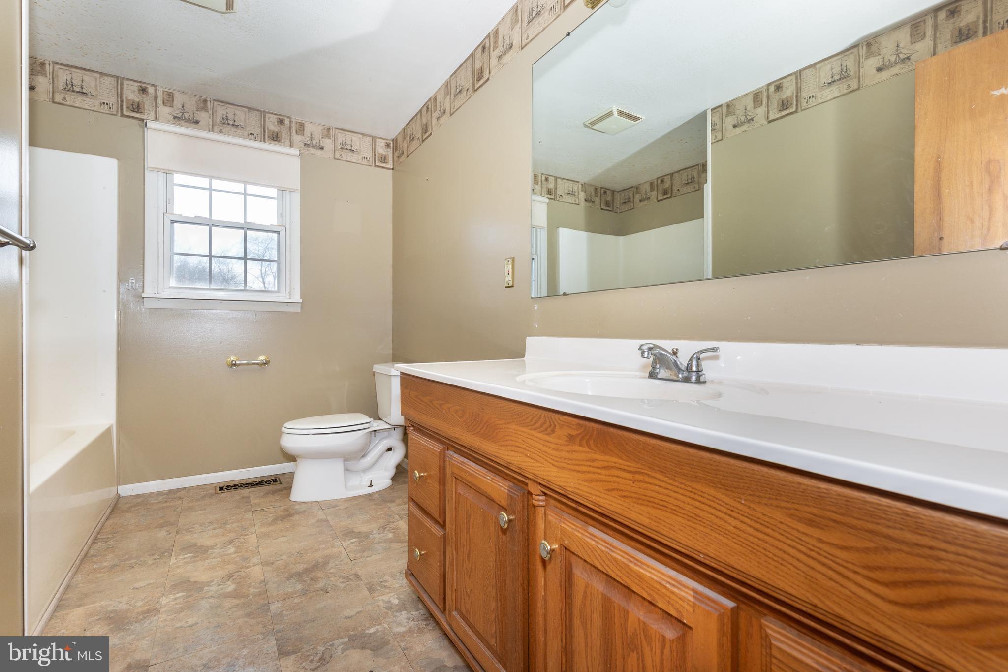 5 Sunset Drive Gettysburg, PA 17325 - Photo 13 of 56 a bathroom with a sink a toilet and a mirror