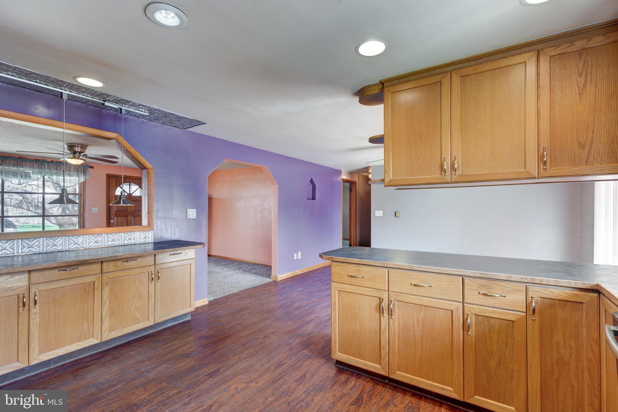 5 Sunset Drive Gettysburg, PA 17325 - Photo 6 of 56 a kitchen with wooden floors and cabinets