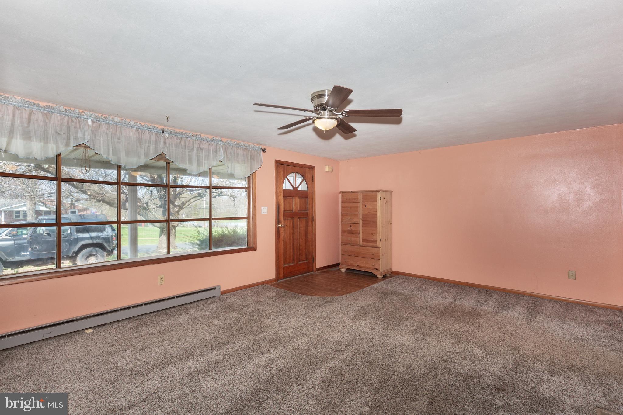 5 Sunset Drive Gettysburg, PA 17325 - Photo 9 of 56 an empty room with chandelier fan and windows