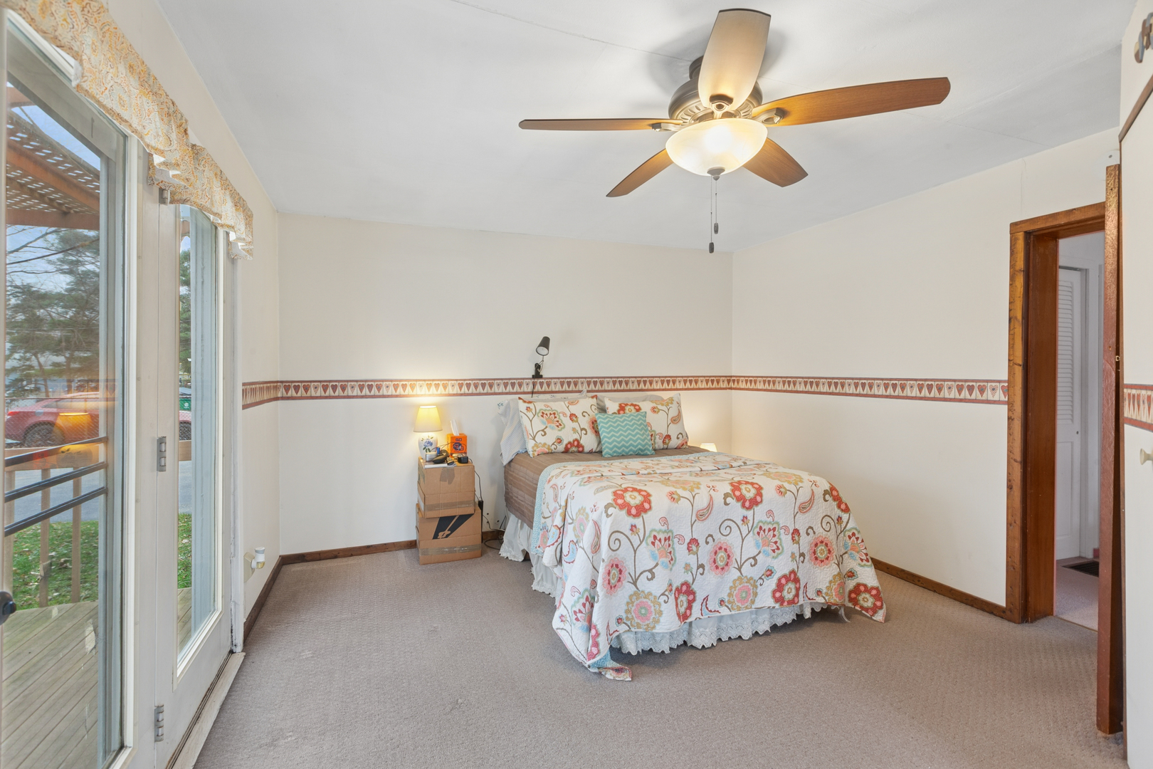 S348 East Street Winfield, IL 60190 - Photo 9 of 23 a bedroom with a bed and a chandelier