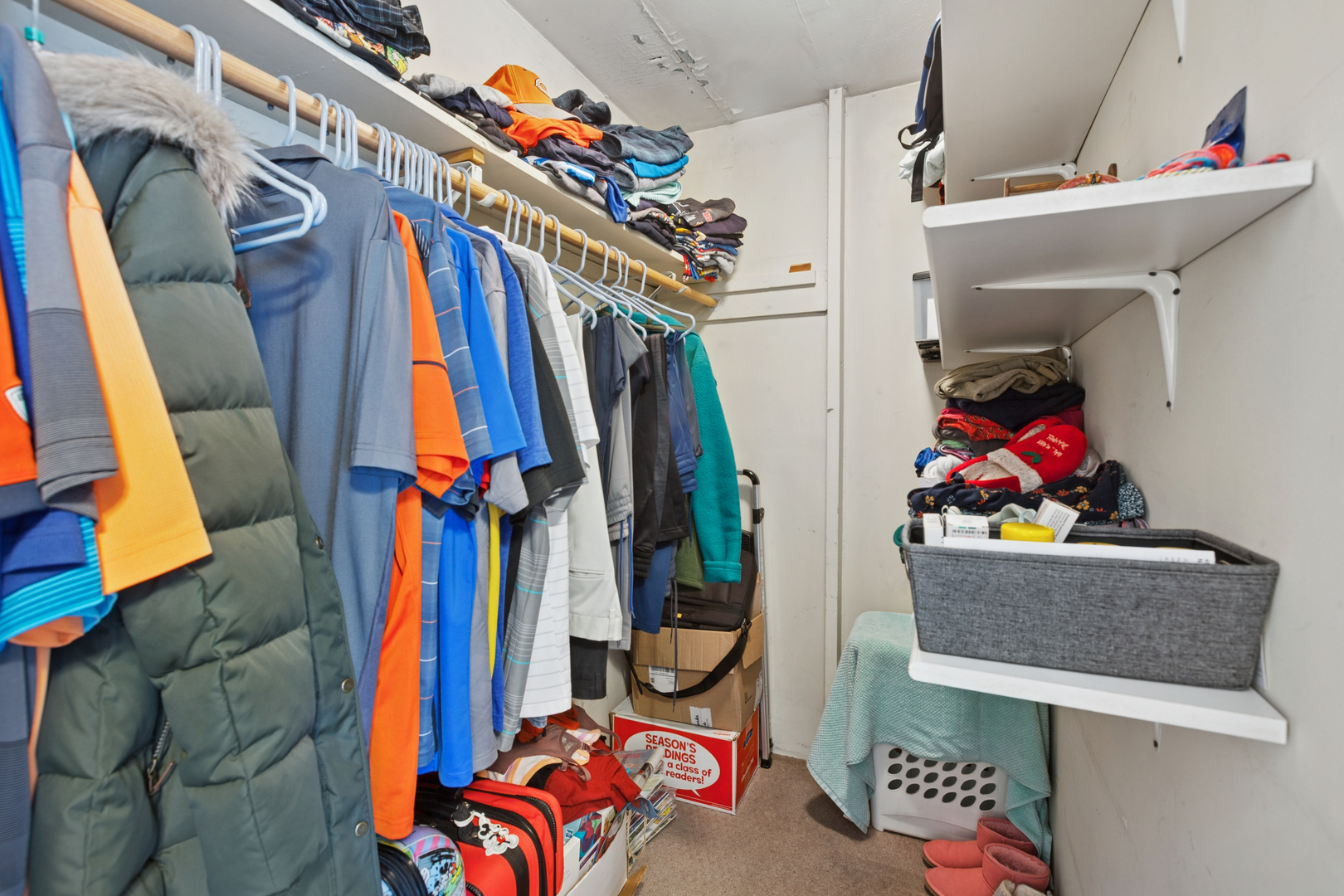 S348 East Street Winfield, IL 60190 - Photo 10 of 23 a view of walk in closet with clothes and shoes