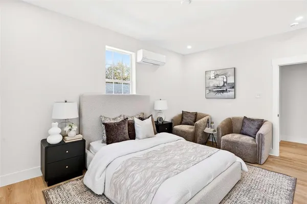 a bedroom with bed and furniture