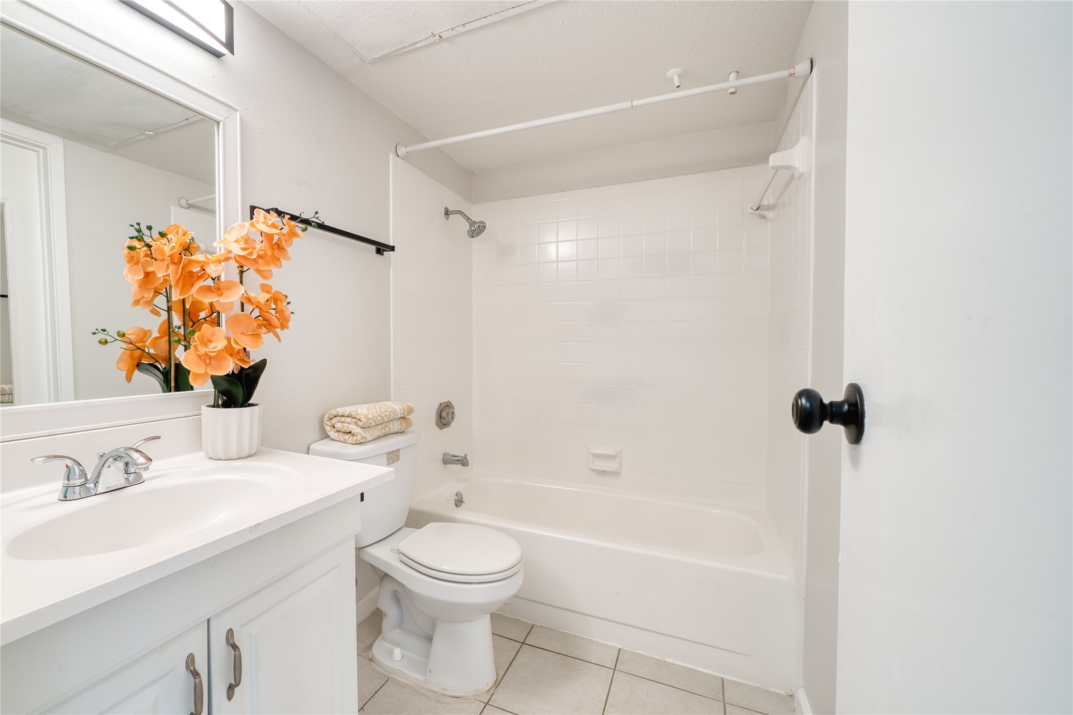 6001 Reims Road, Unit 209 Houston, TX 77036 - Photo 9 of 16 a bathroom with a sink a toilet and shower