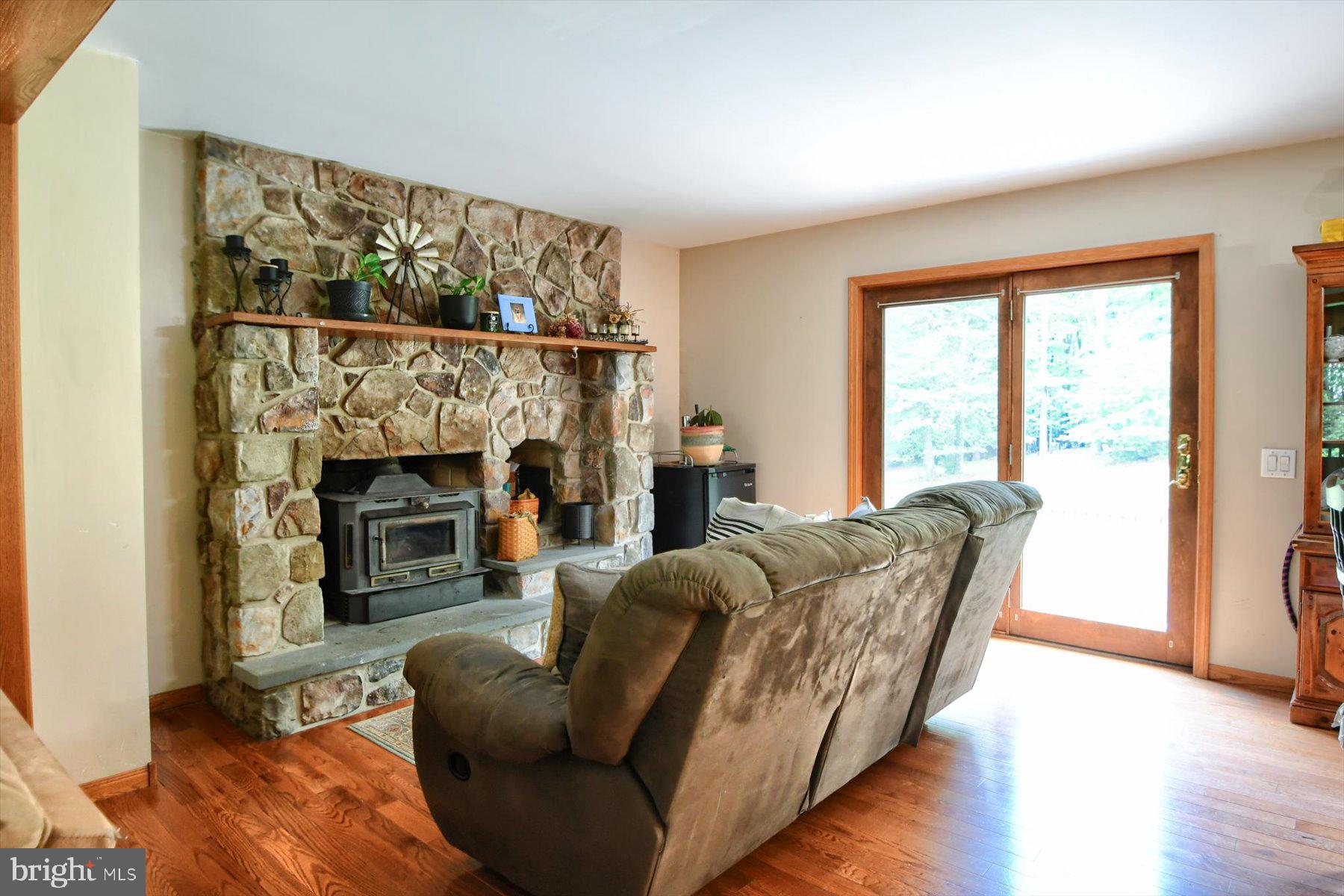 3700 Lehnenberg Road Riegelsville, PA 18077 - Photo 28 of 48 a living room with furniture and a fireplace