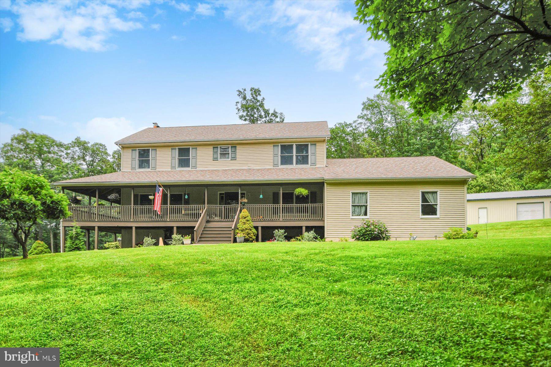 3700 Lehnenberg Road Riegelsville, PA 18077 - Photo 3 of 48 a view of a house with a yard and potted plants