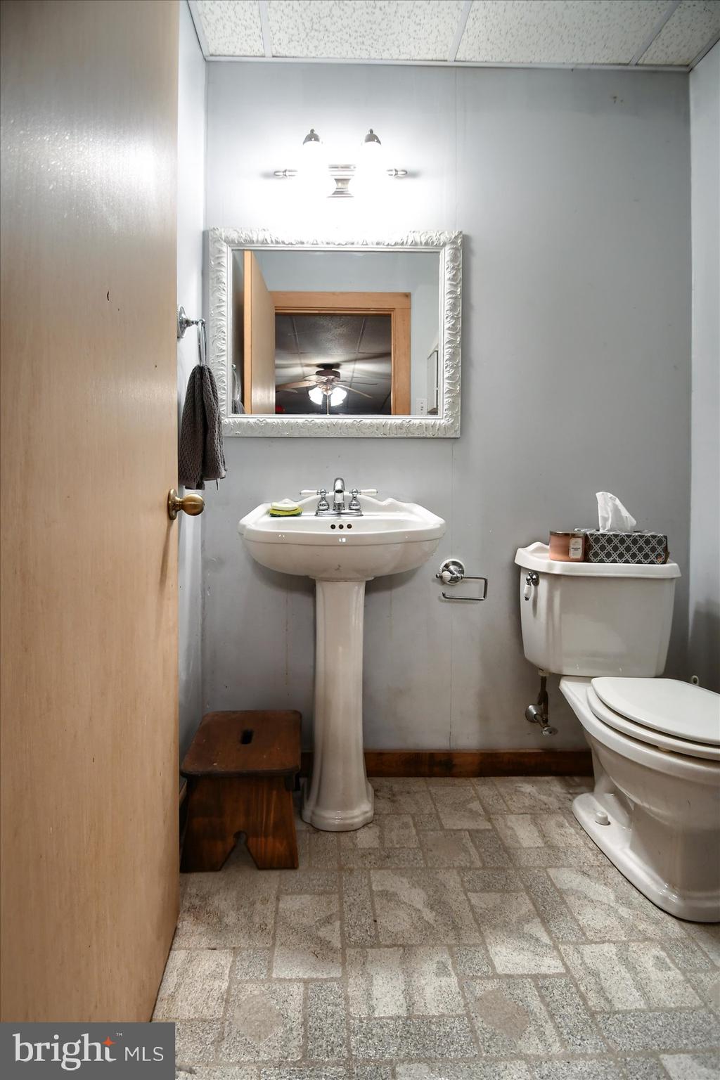 3700 Lehnenberg Road Riegelsville, PA 18077 - Photo 43 of 48 a bathroom with a sink a toilet and mirror