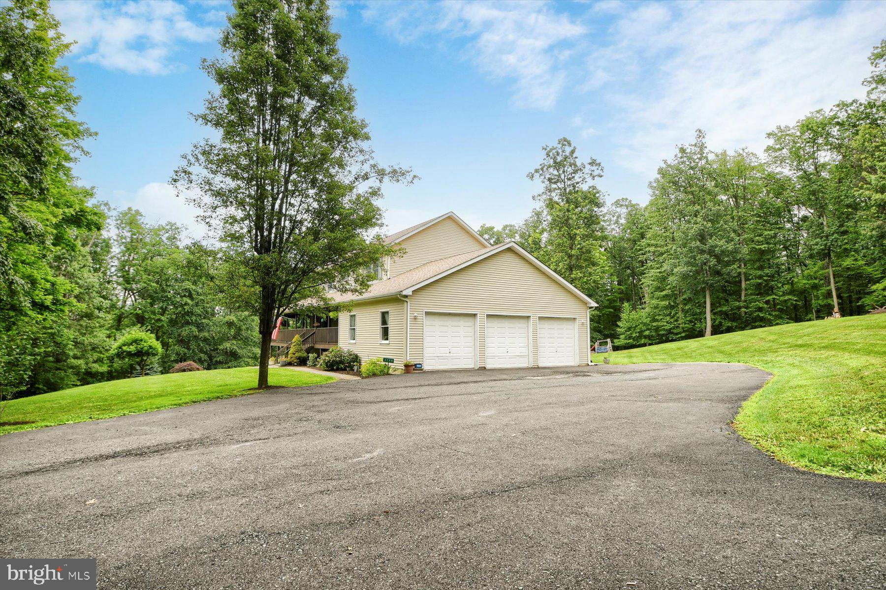 3700 Lehnenberg Road Riegelsville, PA 18077 - Photo 6 of 48 a view of a house with a yard and large trees