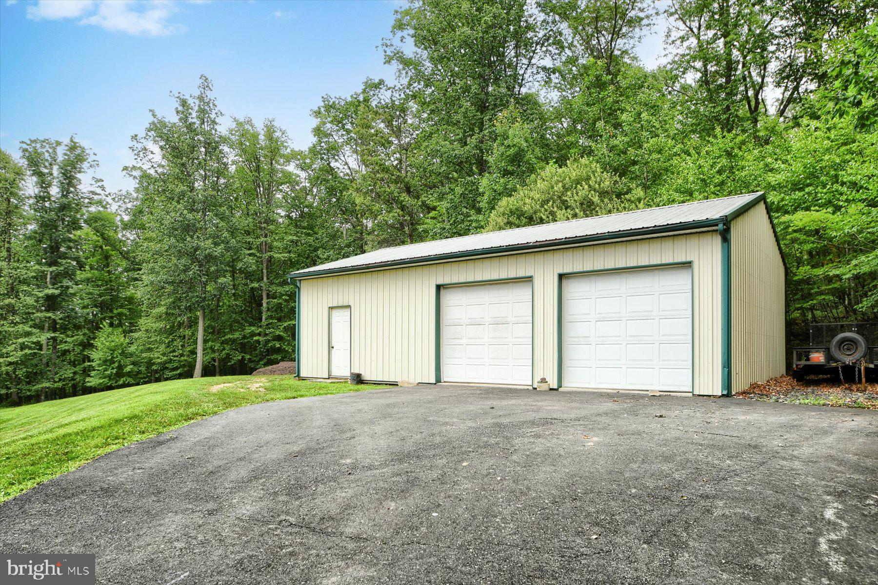 3700 Lehnenberg Road Riegelsville, PA 18077 - Photo 10 of 48 a view of a house with a yard and garage
