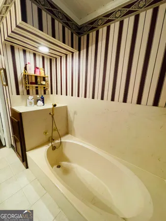 a bathroom with a bathtub and a sink