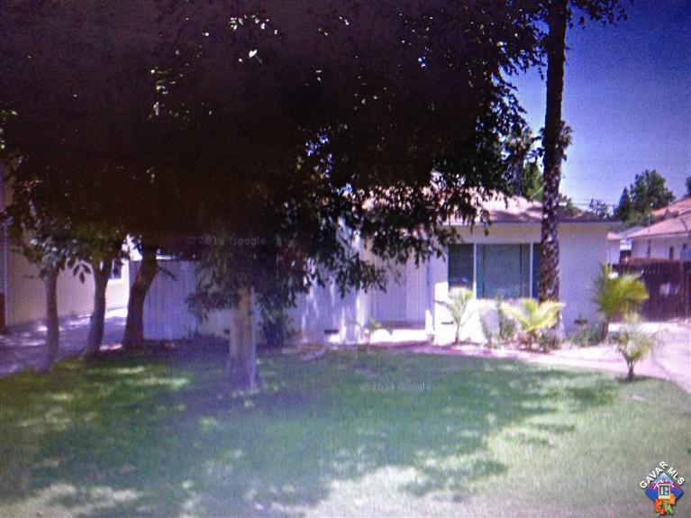 17159 Kingsbury Street Granada Hills, CA 91344 - Photo 1 of 1 a view of a yard with plants and a fountain