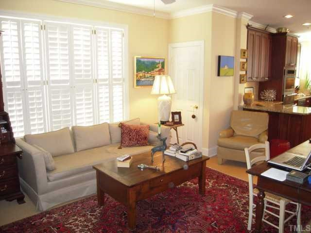 3700 Baron Cooper Pass, Unit 201 Raleigh, NC 27612 - Photo 7 of 12 Den is Open to the Kitchen and Has Plantation Shutters Den/Family/Great Room