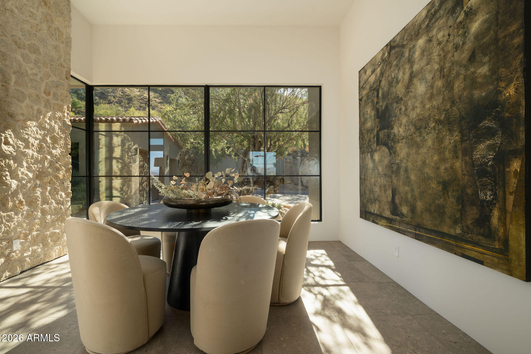 5939 East Quartz Mountain Road Paradise Valley, AZ 85253 - Photo 15 of 39 a dining room with furniture and a floor to ceiling window