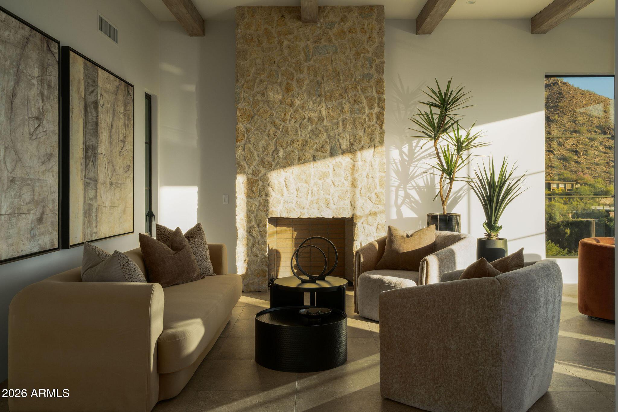 5939 East Quartz Mountain Road Paradise Valley, AZ 85253 - Photo 19 of 39 a living room with furniture and a fireplace