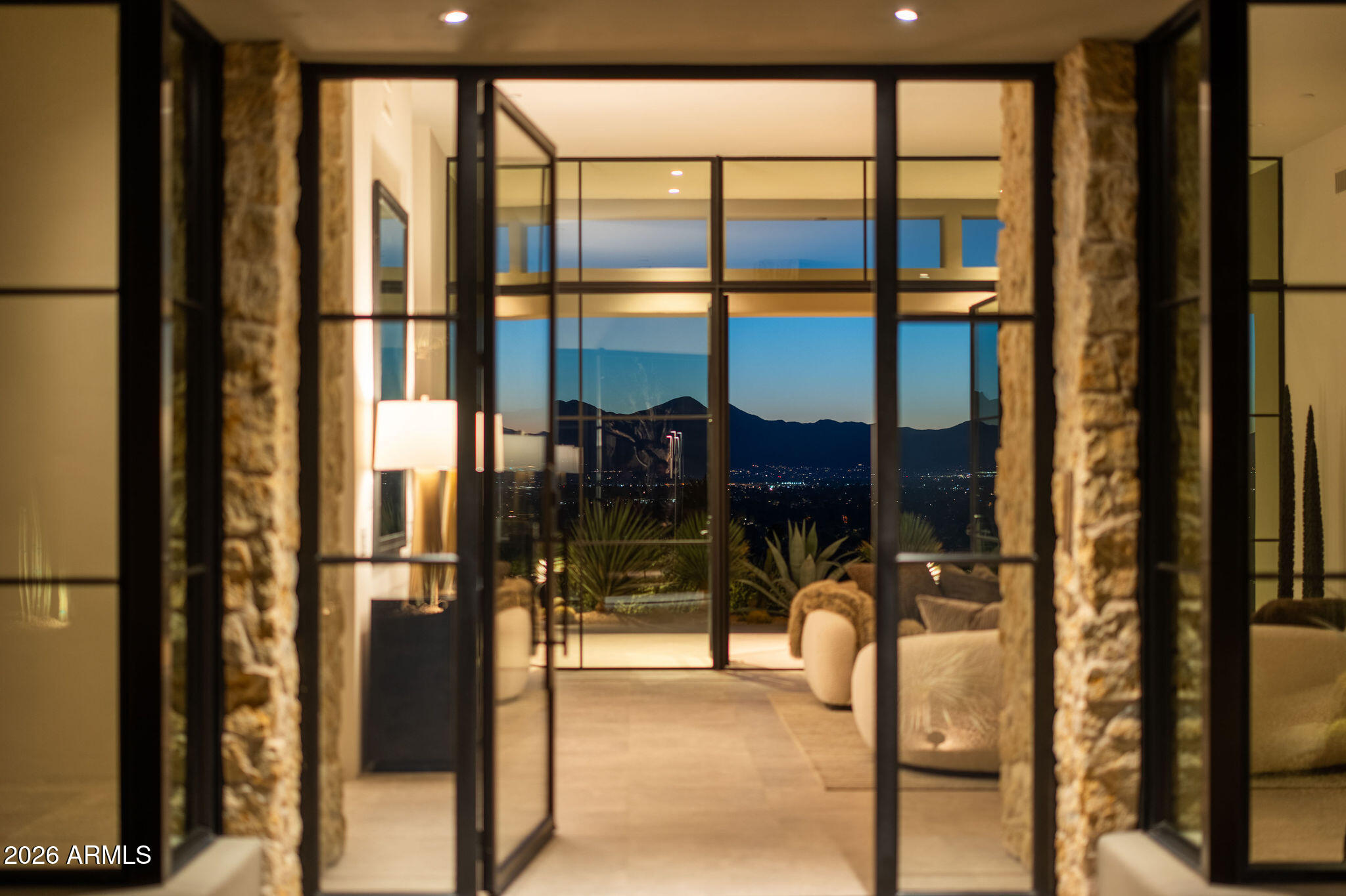 5939 East Quartz Mountain Road Paradise Valley, AZ 85253 - Photo 2 of 39 a bathroom with a glass door
