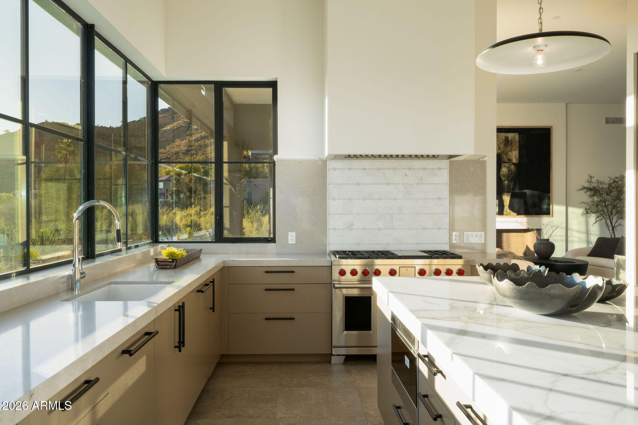 5939 East Quartz Mountain Road Paradise Valley, AZ 85253 - Photo 9 of 39 a kitchen that has a sink and a stove
