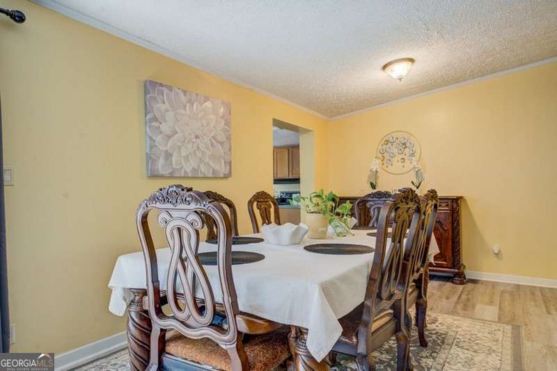 119 Shoals Point Eatonton, GA 31024 - Photo 12 of 110 a view of a dining room with furniture