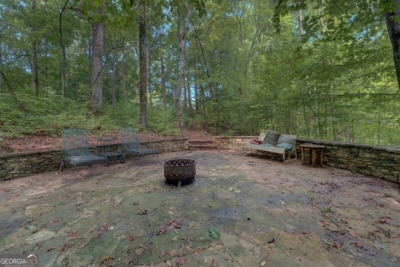 119 Shoals Point Eatonton, GA 31024 - Photo 19 of 110 a view of outdoor space with deck and yard