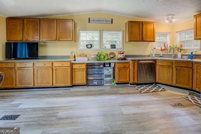 119 Shoals Point Eatonton, GA 31024 - Photo 20 of 110 a kitchen with stainless steel appliances granite countertop a stove a sink and a refrigerator