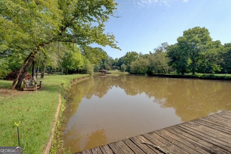 119 Shoals Point Eatonton, GA 31024 - Photo 29 of 110 a view of a lake with houses in outdoor space