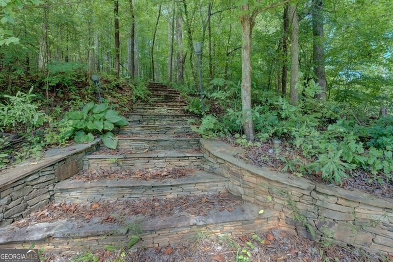 119 Shoals Point Eatonton, GA 31024 - Photo 31 of 110 a view of a yard with plants and large trees