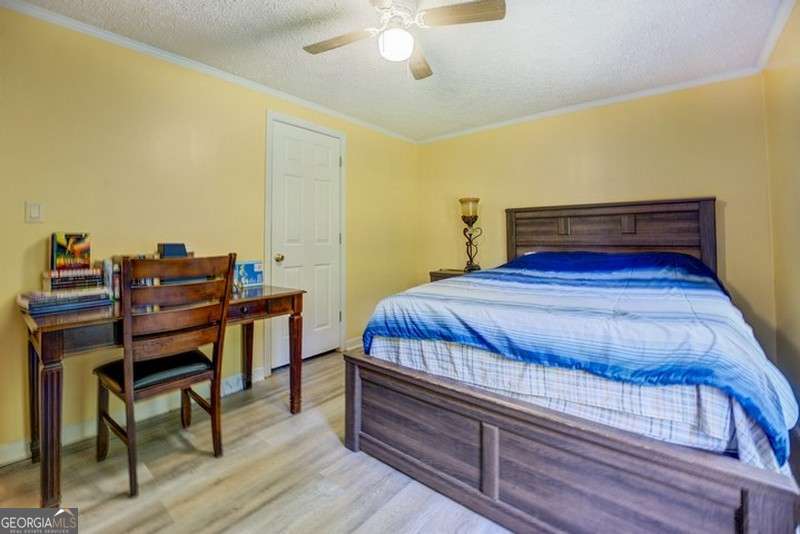 119 Shoals Point Eatonton, GA 31024 - Photo 52 of 110 a bedroom with a bed and a table