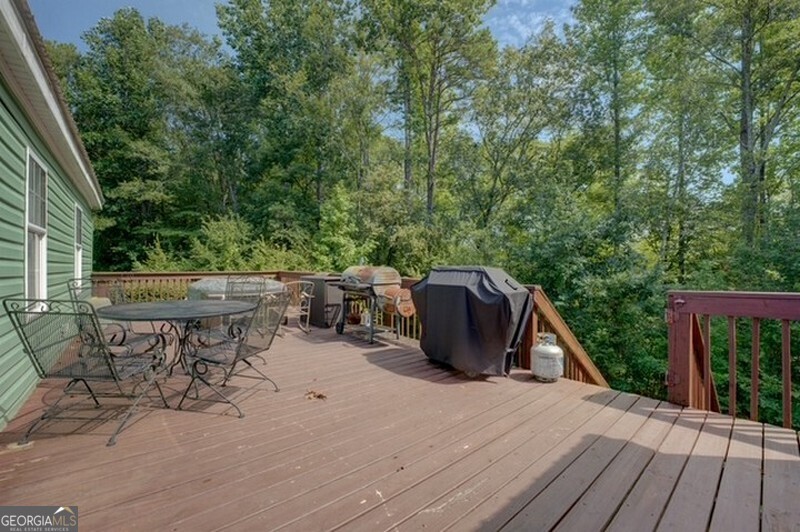 119 Shoals Point Eatonton, GA 31024 - Photo 9 of 110 a view of a patio with a table and chairs