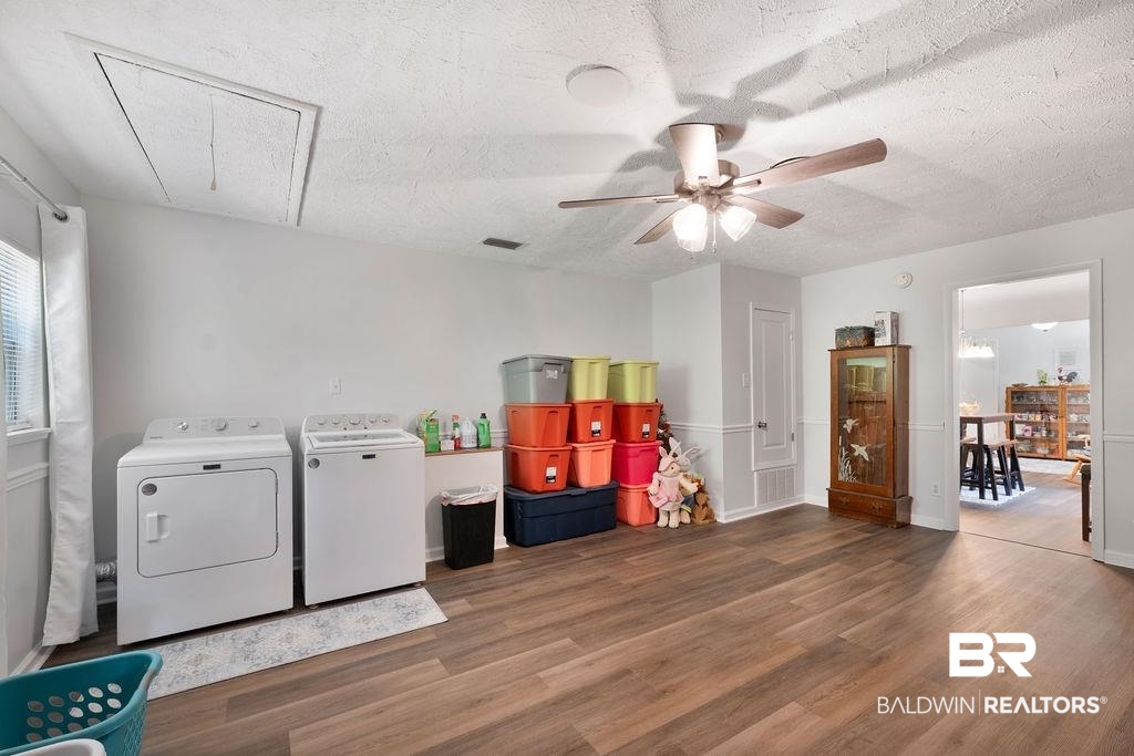 11901 Old Moffat Road Wilmer, AL 36587 - Photo 21 of 39 Laundry area with a textured ceiling, dark wood finished floors, a ceiling fan, and washing machine and dryer