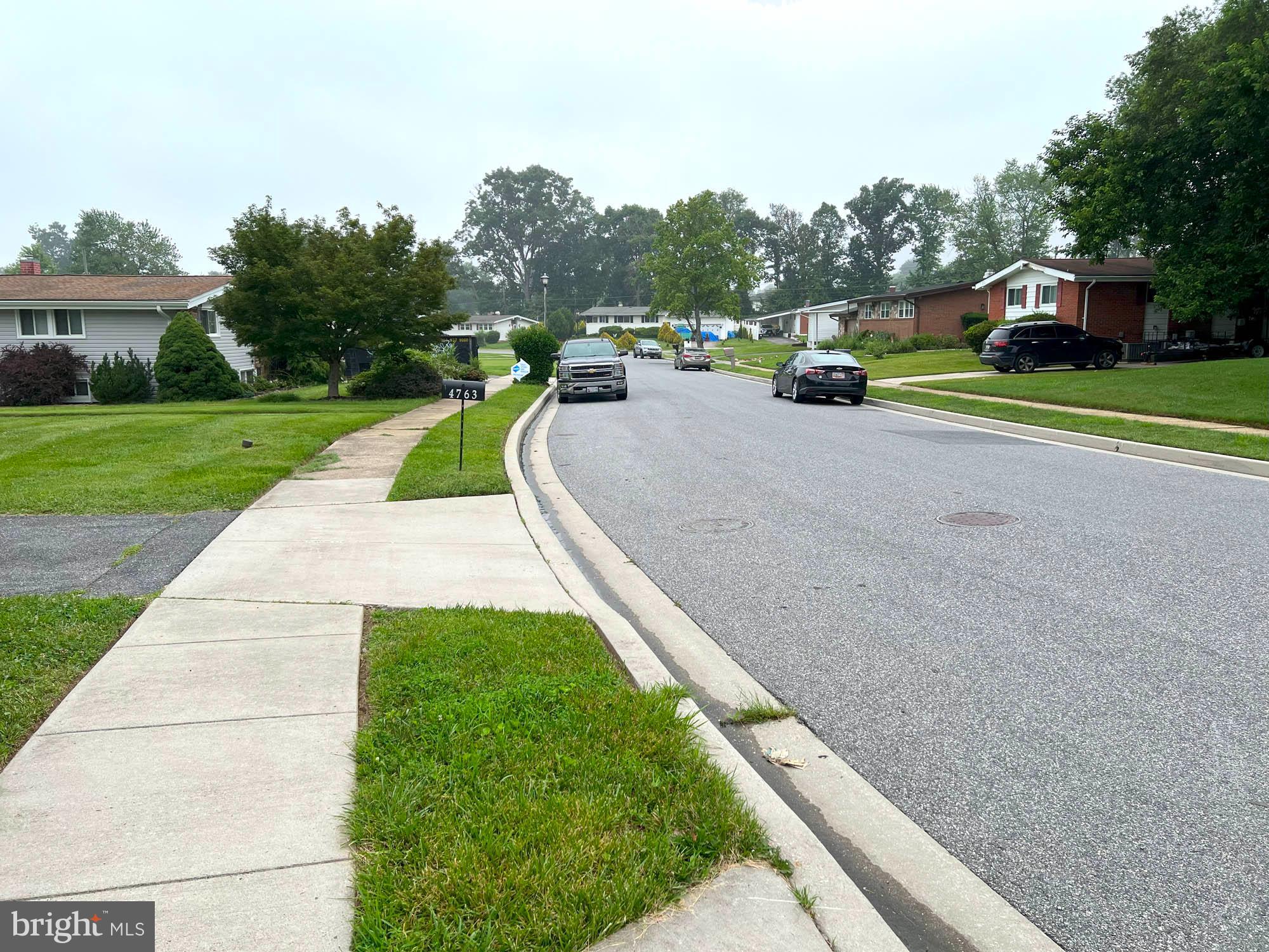4761 Bonnie Brae Road Pikesville, MD 21208 - Photo 14 of 15 a view of a street with houses