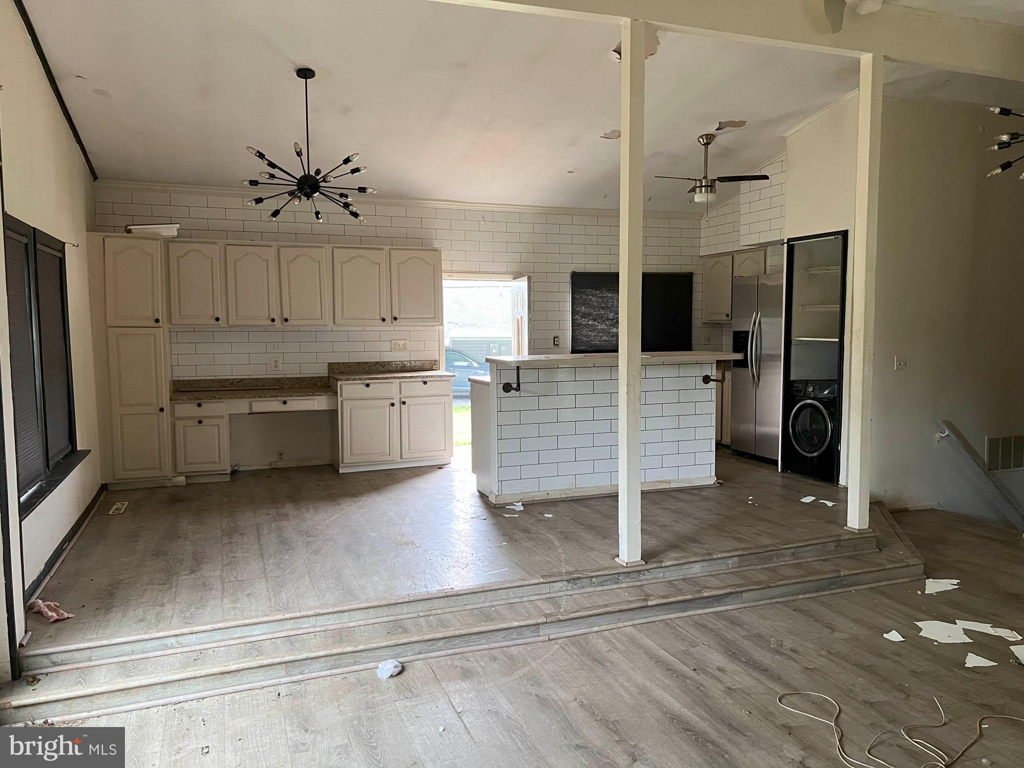 4761 Bonnie Brae Road Pikesville, MD 21208 - Photo 5 of 15 a large kitchen with cabinets and stainless steel appliances