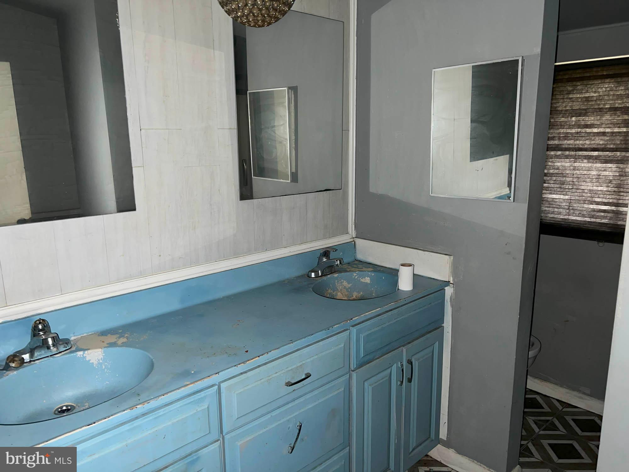 4761 Bonnie Brae Road Pikesville, MD 21208 - Photo 10 of 15 a bathroom with a sink and a mirror