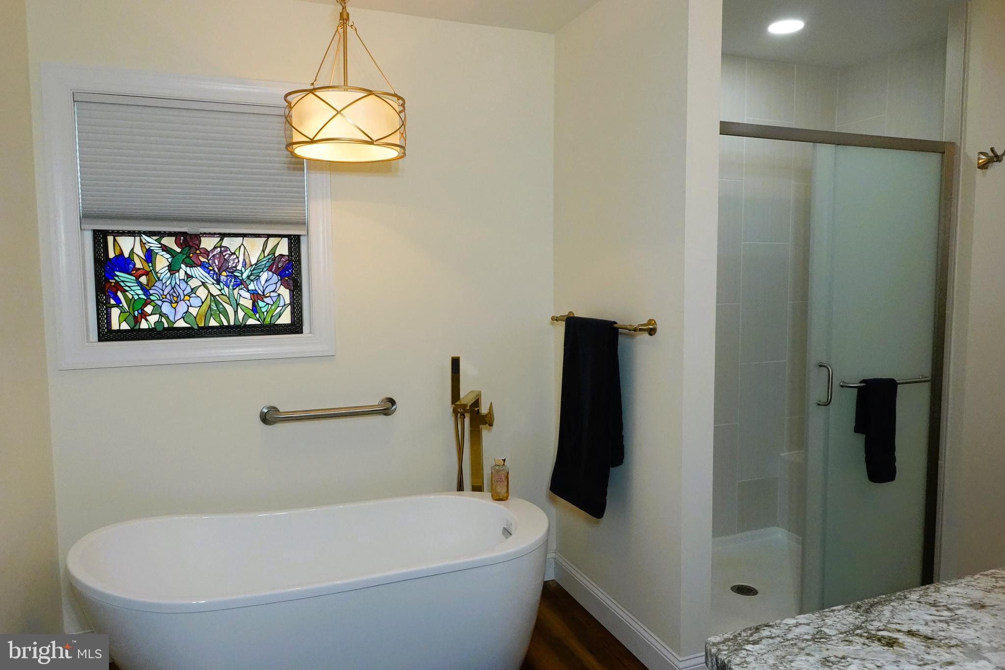 1604 Deep Point Road Woolford, MD 21677 - Photo 22 of 49 a bathroom with a sink and a mirror