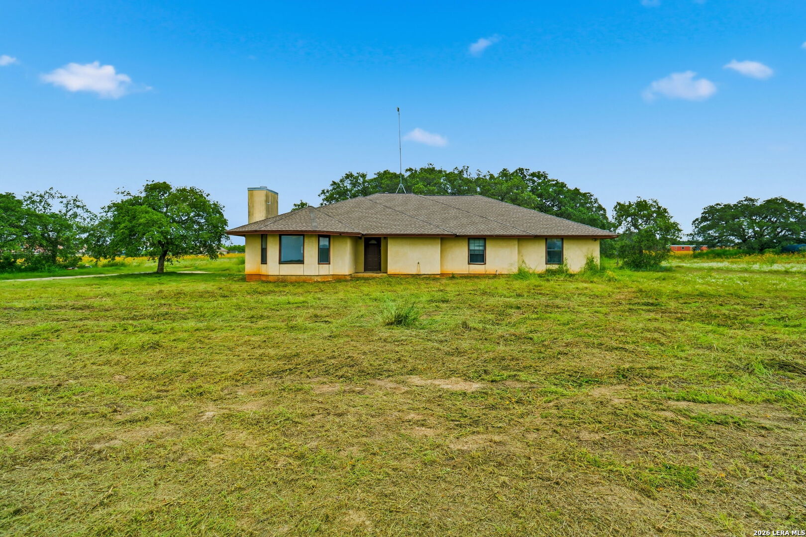 3061 Horse Ranch Road San Antonio, TX 78264 - Photo 28 of 34 a front view of a house with a garden
