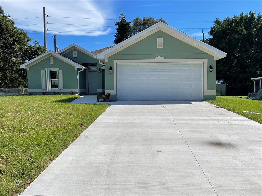 4529 Tortoise Road Venice, FL 34293 - Photo 1 of 1 a front view of a house with a yard and garage