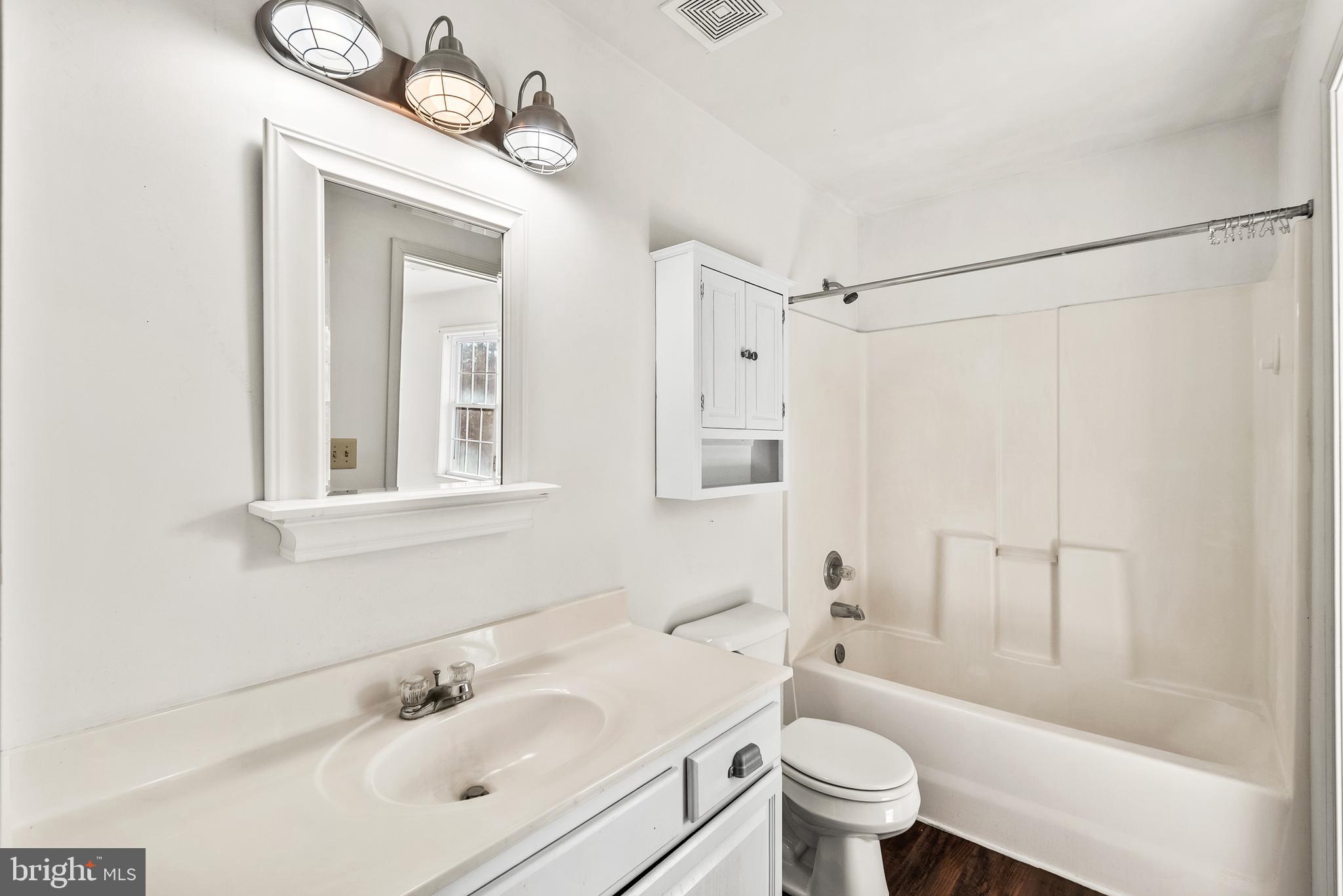 18159 Miss Clara Lane Ruther Glen, VA 22546 - Photo 19 of 31 a bathroom with a sink a toilet and a mirror