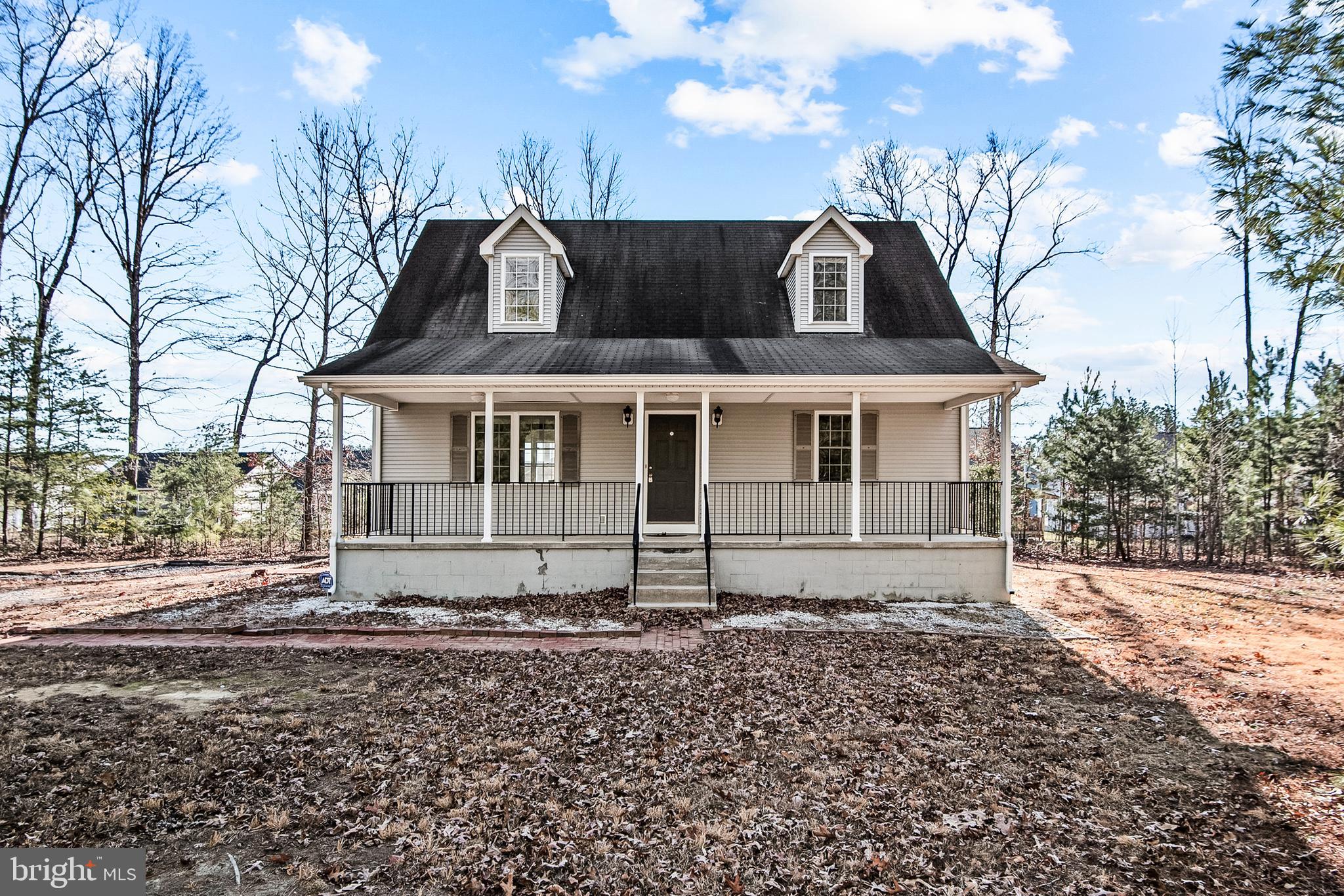 18159 Miss Clara Lane Ruther Glen, VA 22546 - Photo 2 of 31 a front view of a house with a yard