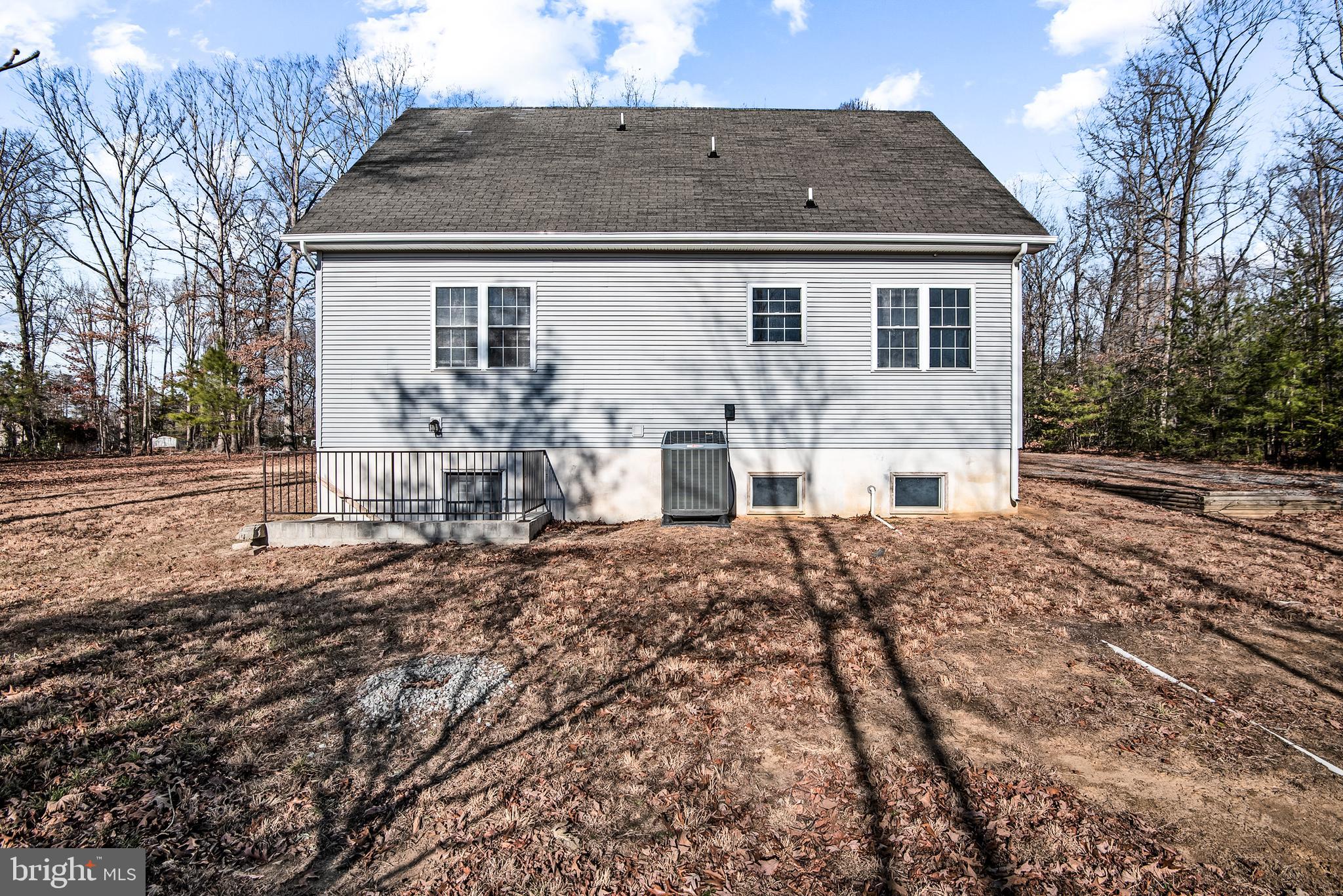 18159 Miss Clara Lane Ruther Glen, VA 22546 - Photo 28 of 31 a front view of a house with garden