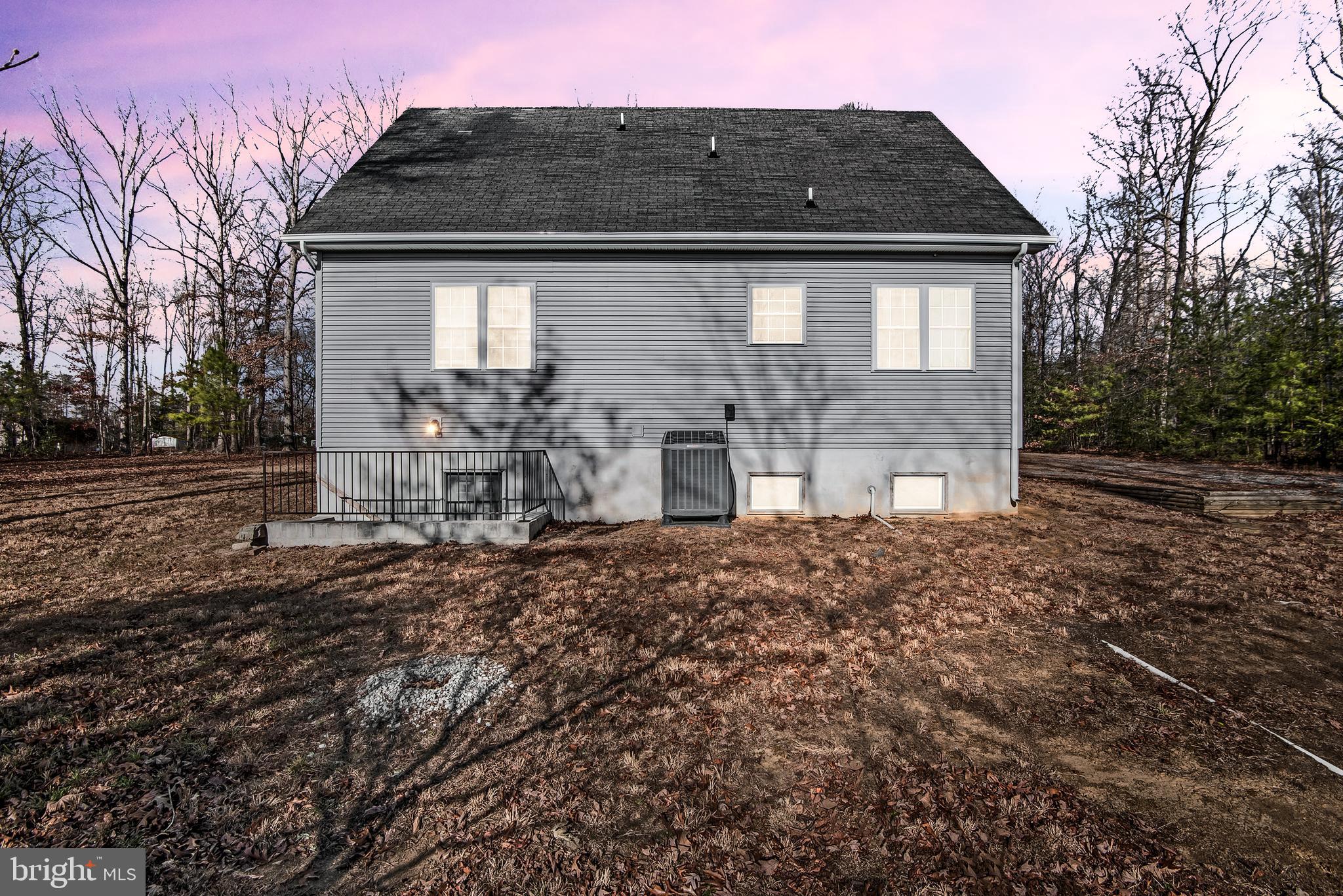 18159 Miss Clara Lane Ruther Glen, VA 22546 - Photo 29 of 31 a front view of a house with garden