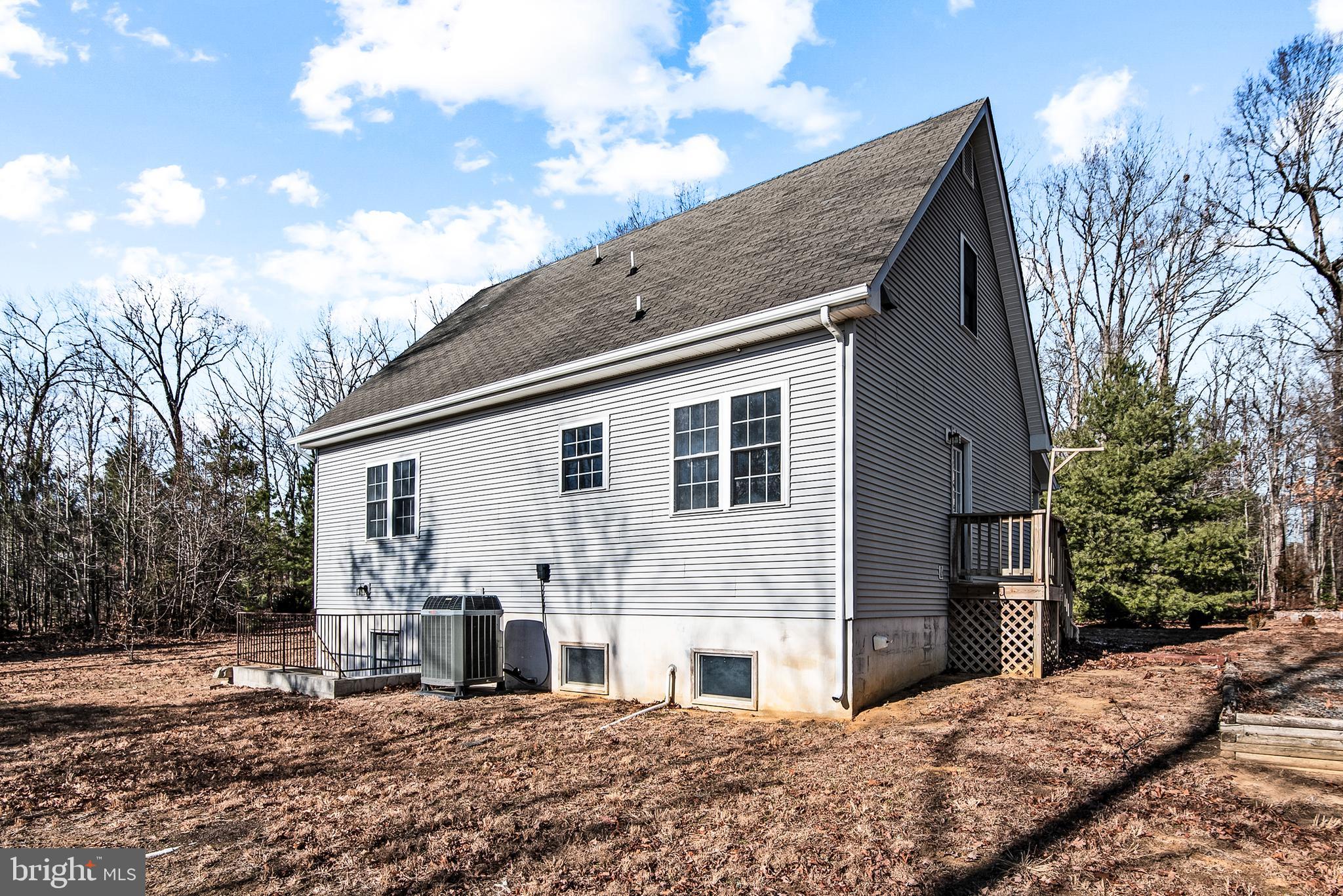 18159 Miss Clara Lane Ruther Glen, VA 22546 - Photo 30 of 31 a front view of a house with a yard