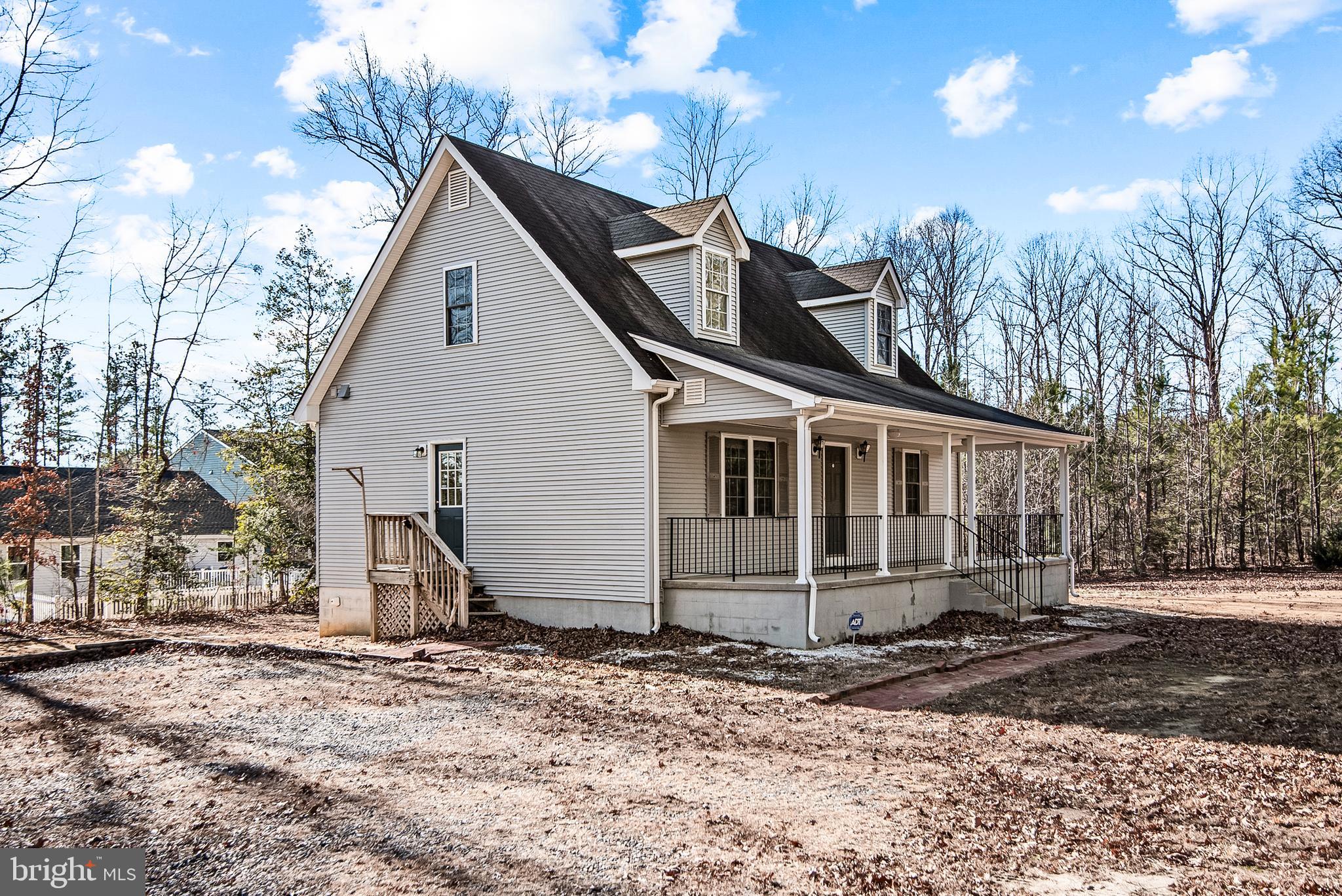 18159 Miss Clara Lane Ruther Glen, VA 22546 - Photo 3 of 31 a front view of a house with a yard