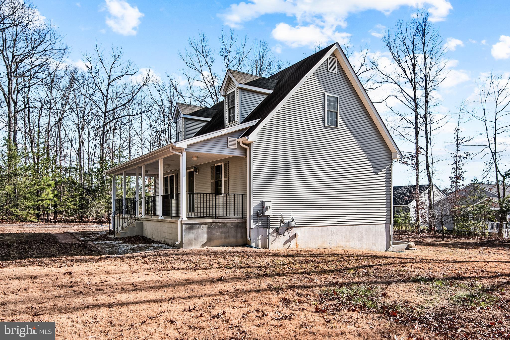 18159 Miss Clara Lane Ruther Glen, VA 22546 - Photo 4 of 31 a view of a house with a yard and large trees