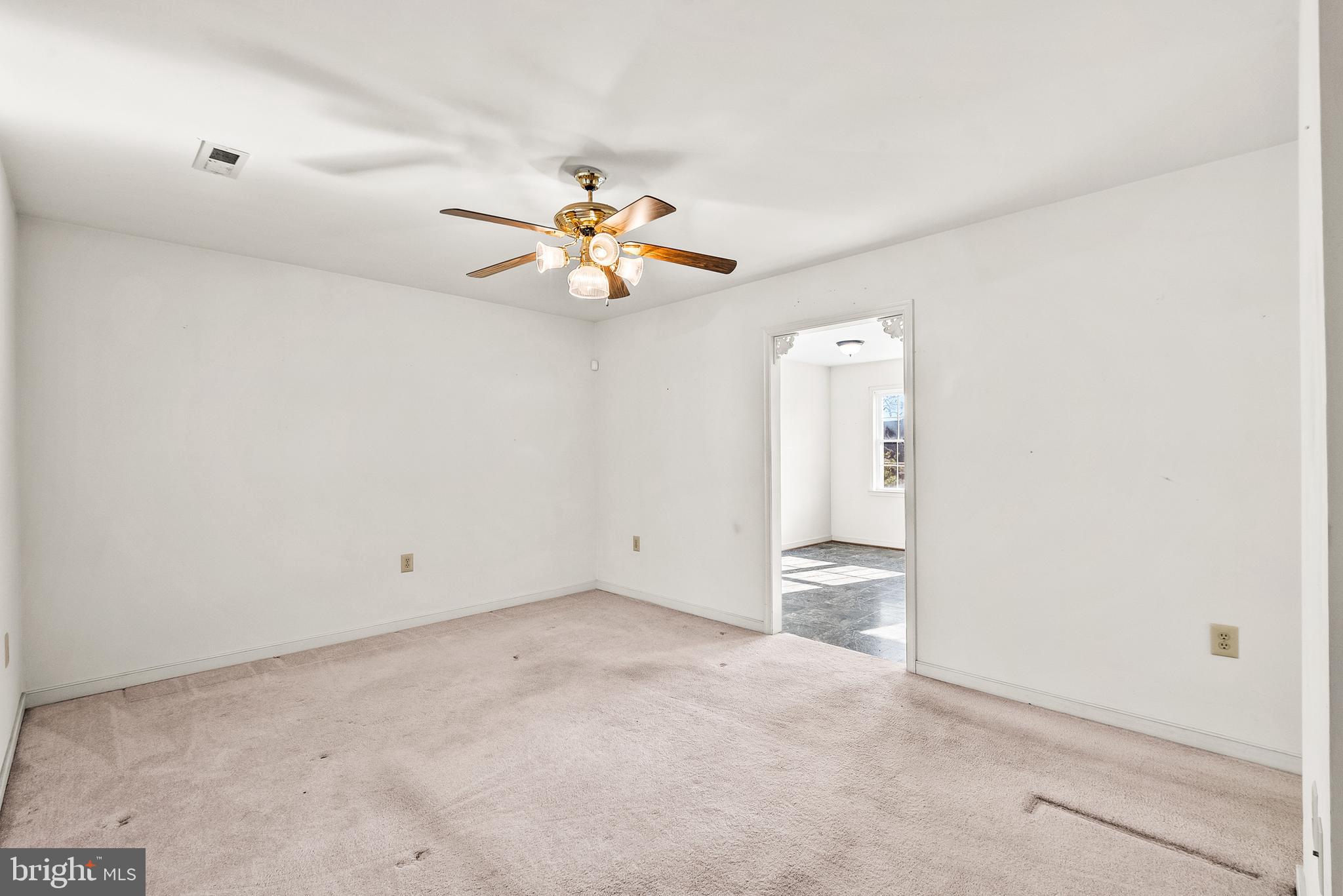 18159 Miss Clara Lane Ruther Glen, VA 22546 - Photo 6 of 31 an empty room with a window and a ceiling fan
