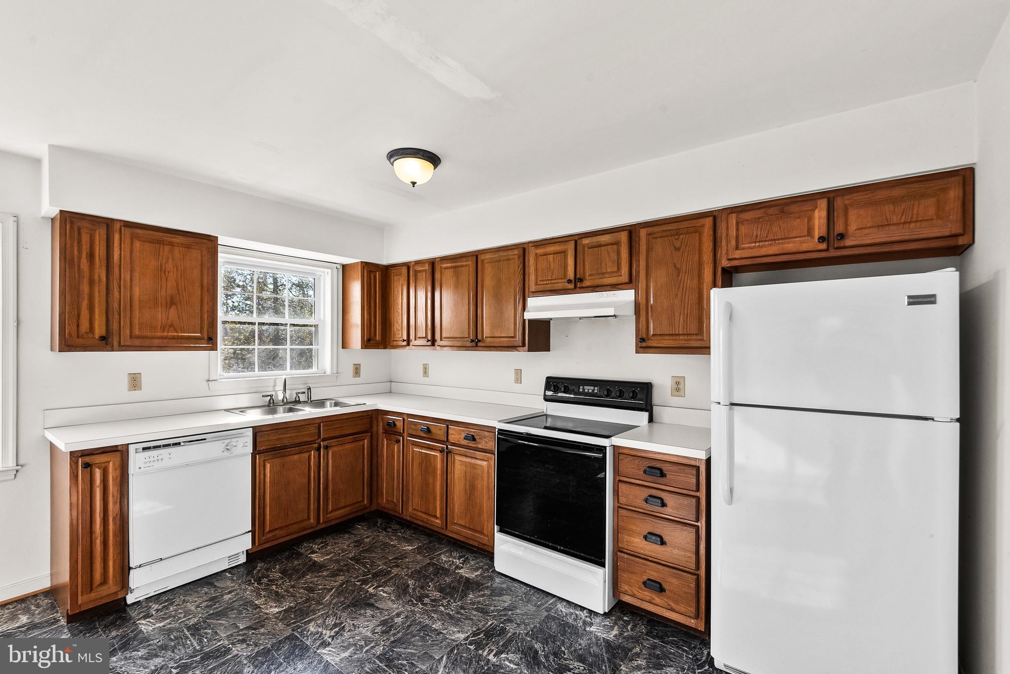 18159 Miss Clara Lane Ruther Glen, VA 22546 - Photo 8 of 31 a kitchen with stainless steel appliances granite countertop a sink stove and refrigerator