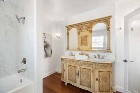 a bathroom with a bathtub and a shower