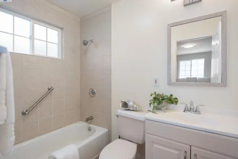 a kitchen with sink cabinets and window