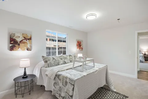 a bed room with a bed and a lamp