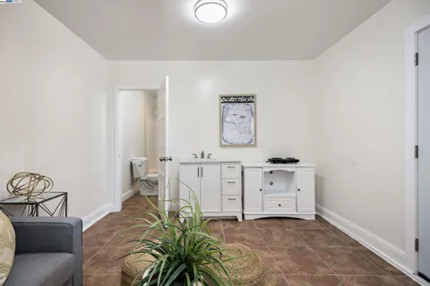 a bathroom with a granite countertop toilet a sink and a bathtub