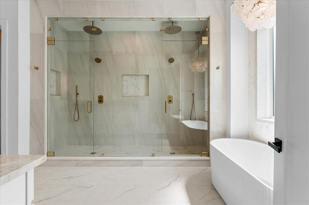10576 Buccaneer Point Frisco, TX 75036 - Photo 22 of 40 a bathroom with a shower and a bathtub