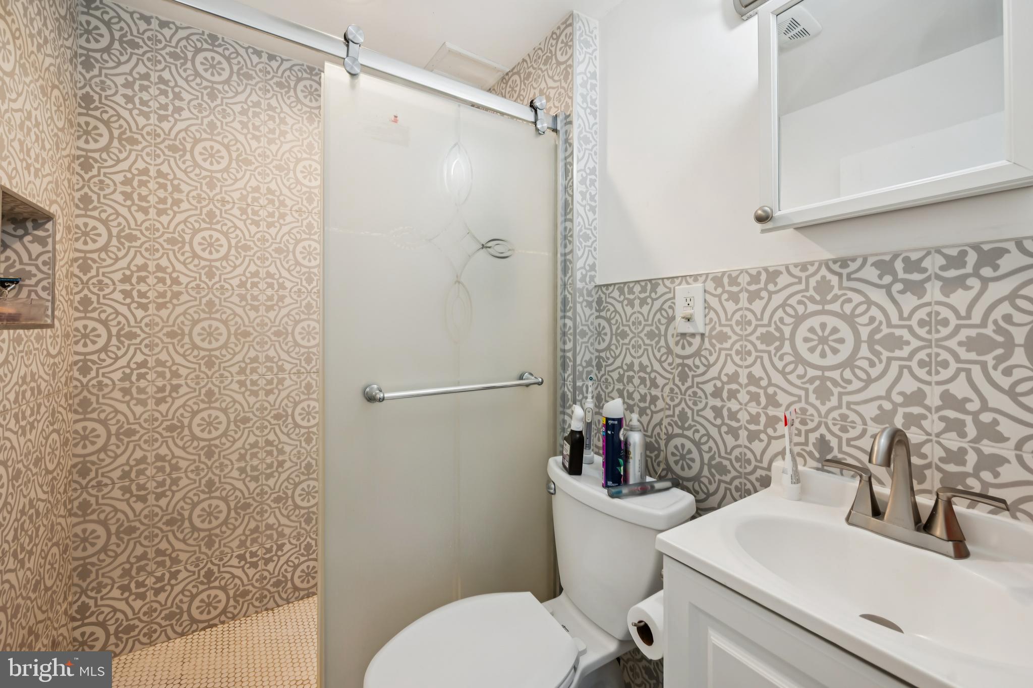 640 Bem Street Riverside, NJ 08075 - Photo 12 of 26 a bathroom with a sink toilet and shower