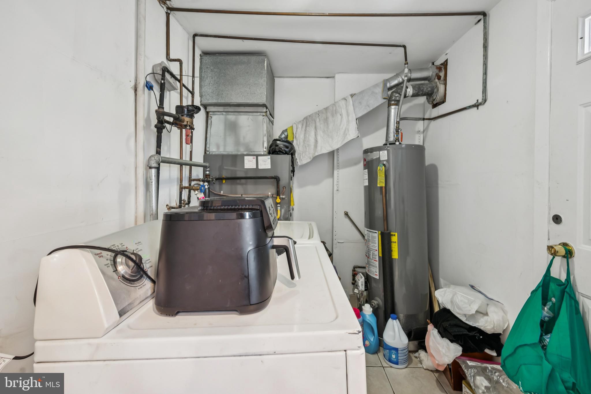 640 Bem Street Riverside, NJ 08075 - Photo 13 of 26 a view of storage and utility room with racks on the wall